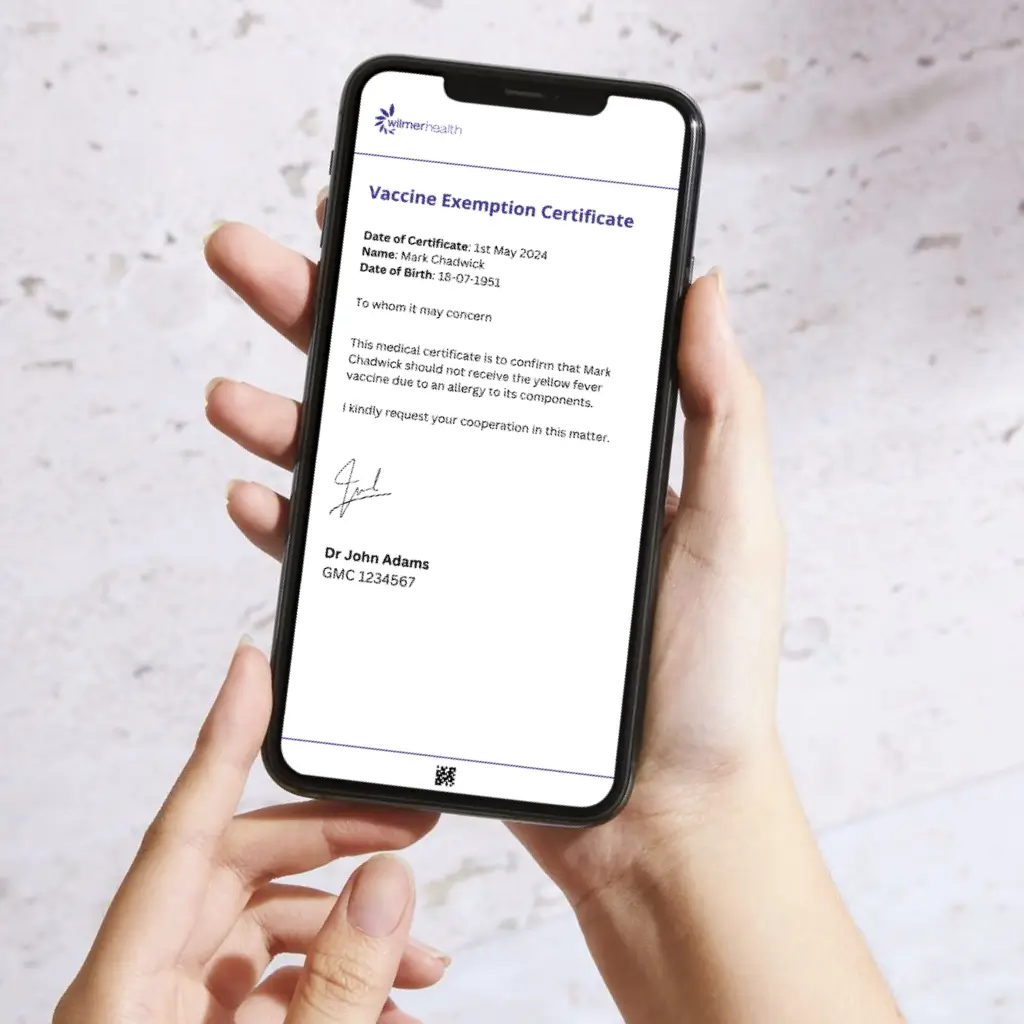 Mockup of Wilmer Health's yellow fever vaccine exemption certificate displayed on an iPhone screen. The digital certificate verifies exemption from the yellow fever vaccine, suitable for individuals unable to receive the vaccine due to medical reasons.