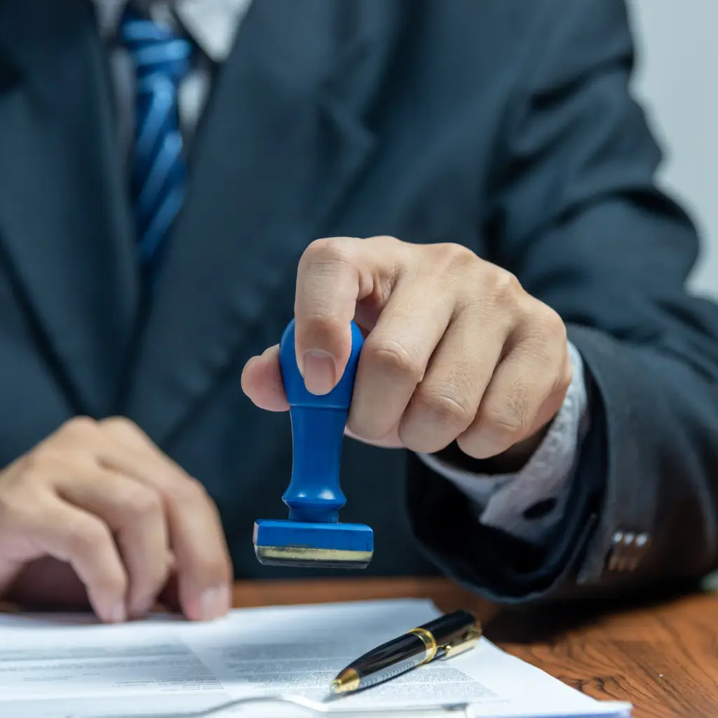 UK licensed doctor registered with the FCDO signing and stamping a Spanish Visa Medical Certificate via Wilmer Health