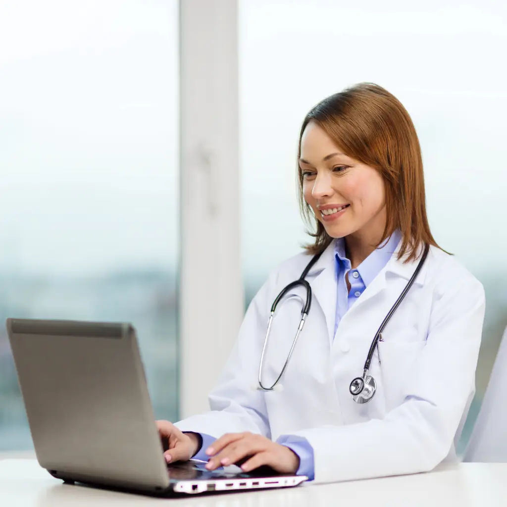 UK medical doctor from Wilmer Health signing and stamping Spanish Visa Medical Certificate