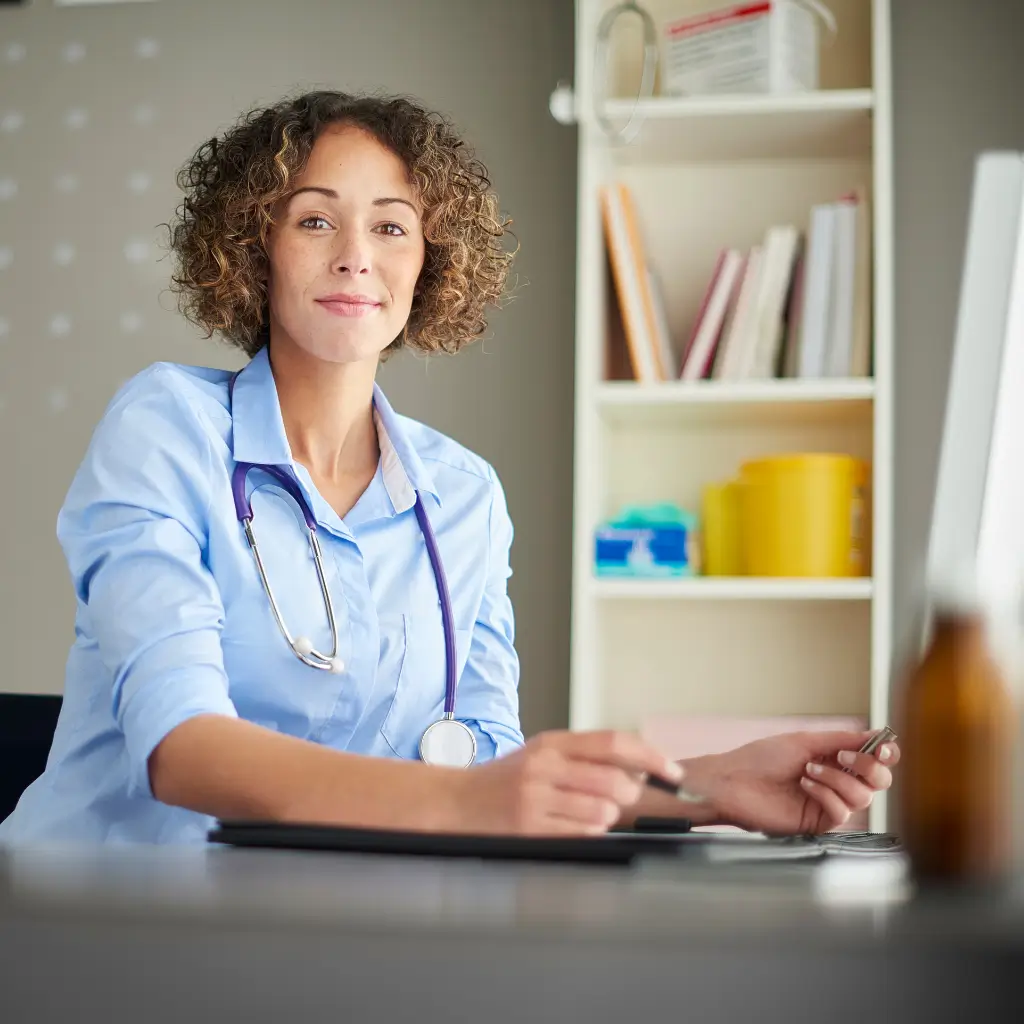 UK registered doctor from Wilmer Health completing online Spanish Visa Medical Certificate and emailing and posting to customer