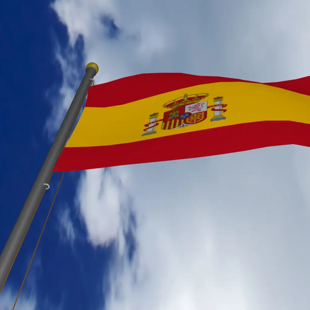 A Spanish flag flying in the air, symbolising the Medical Certificate for Spanish visa service provided by Wilmer Health for those applying for a Spanish Student Visa