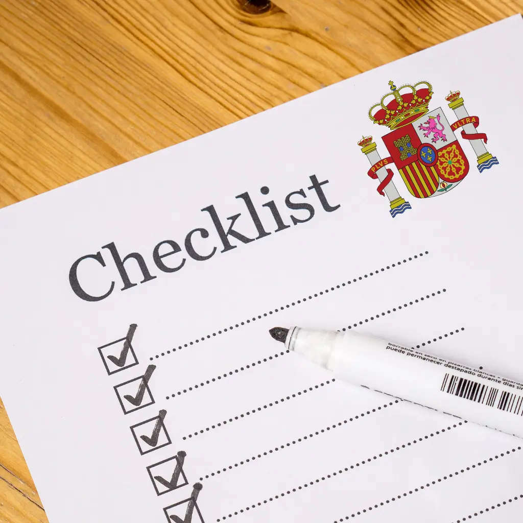 A person using a checklist on what is needed for Spain's digital nomad visa using Wilmer Health articles